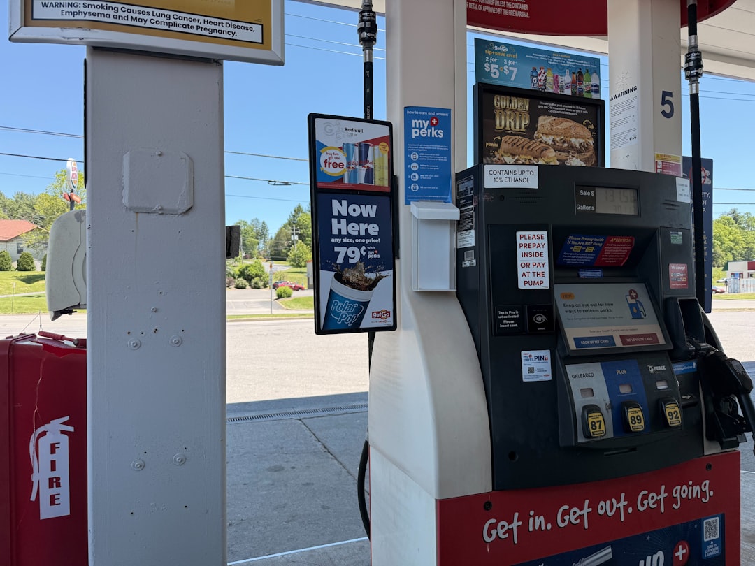 A gas pump at a station on a sunny day